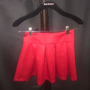 Red high waisted pleated skirt